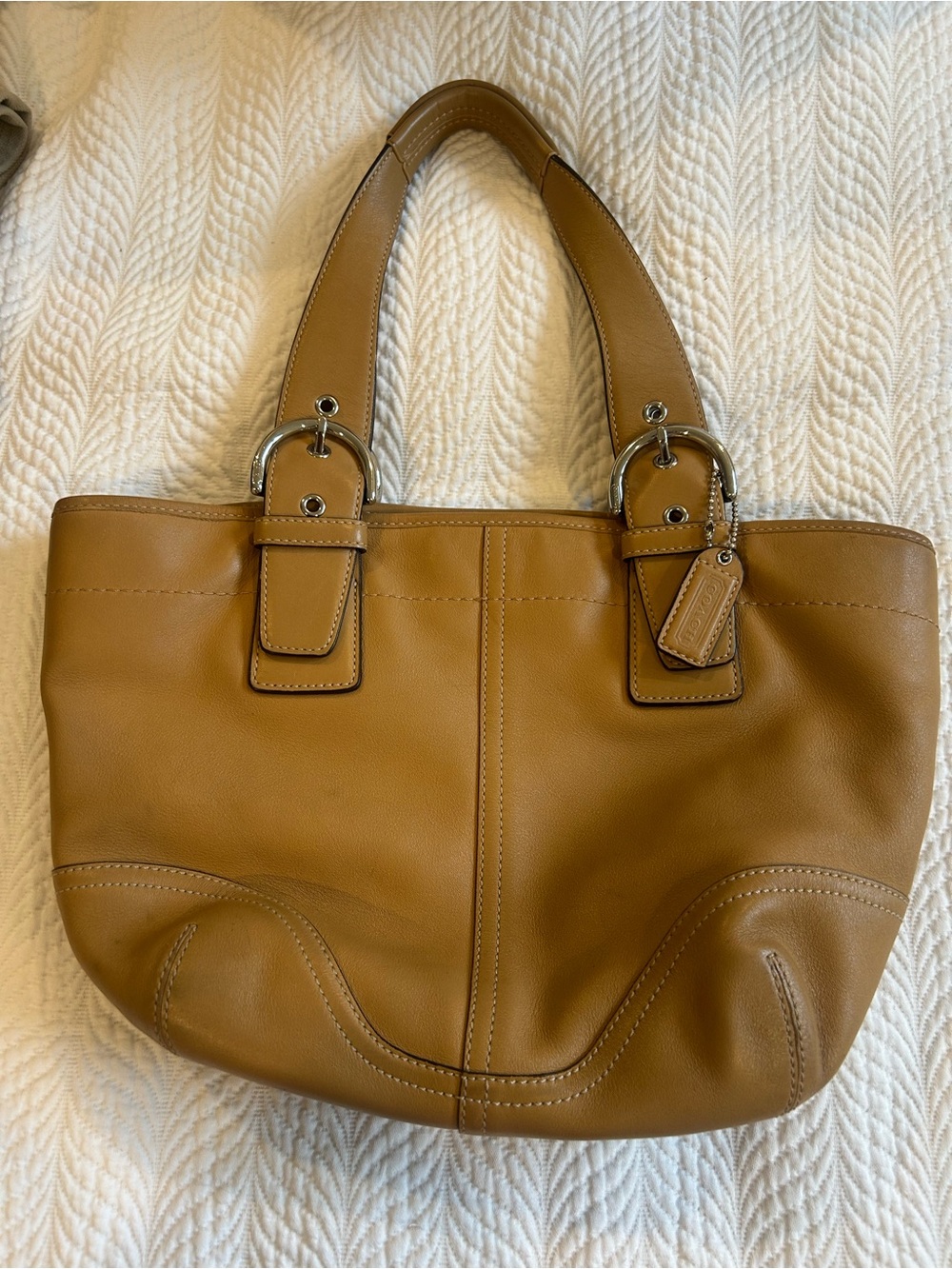 Coach tan handbag.